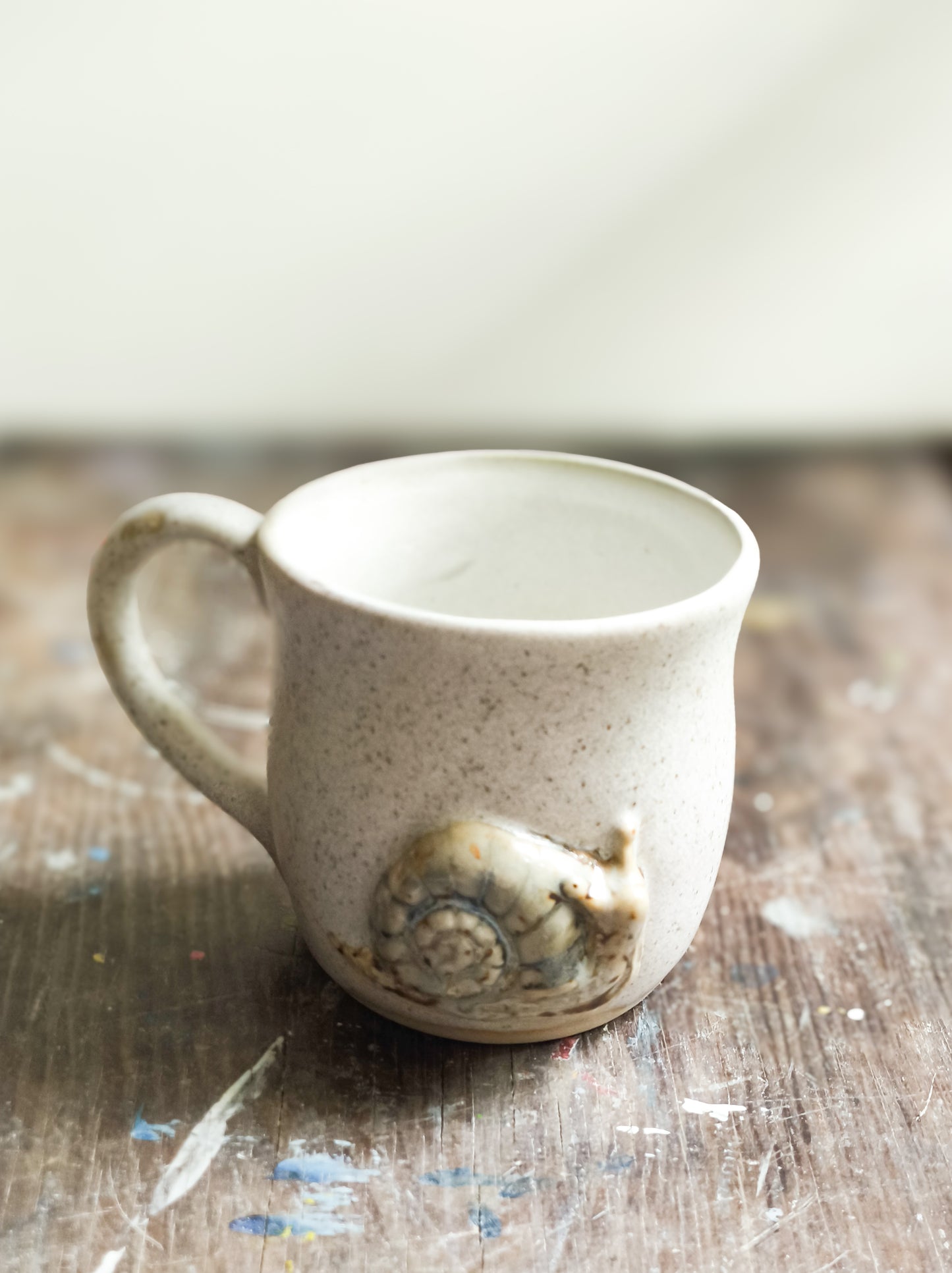 Ceramic cup with snail