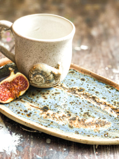 Ceramic cup with snail